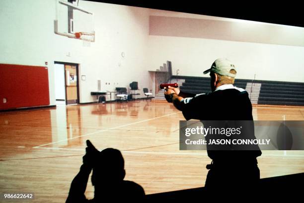 Trainee takes part in a simulated active shooter drill during a three day firearms course for school teachers and administrators sponsored by FASTER...