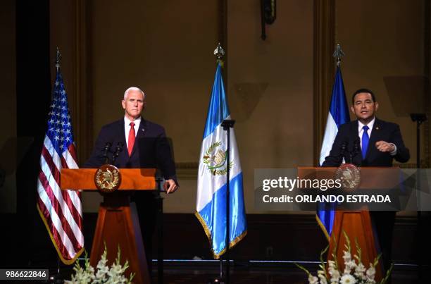 Vice-President Mike Pence and Guatemalan President Jimmy Morales deliver a joint press conference at the Culture Palace in Guatemala City on June 28,...