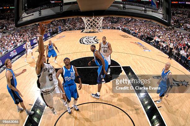 George Hill of the San Antonio Spurs shoots past Jason Terry of the Dallas Mavericks in Game Four of the Western Conference Quarterfinals during the...