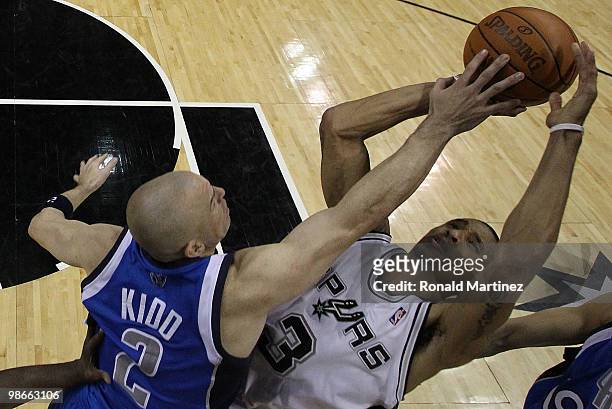 Guard George Hill of the San Antonio Spurs takes a shot against Jason Kidd of the Dallas Mavericks in Game Four of the Western Conference...