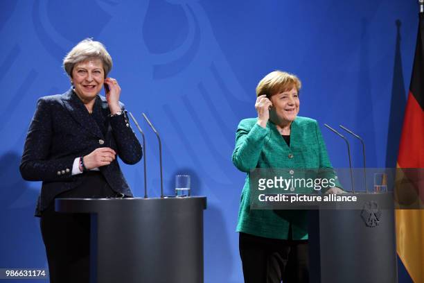 February 2018, Berlin, Germany: German chancellor Angela Merkel and Great Britains Prime Minister Theresa May partake in a joint press conference...