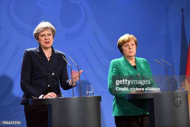 February 2018, Berlin, Germany: German chancellor Angela Merkel and Great Britains Prime Minister Theresa May partake in a joint press conference...