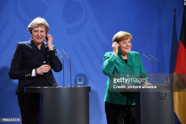 German Chancellor Angela Merkel speaks during a press conference with UK Prime Minister Theresa May after their meeting in the Federal Chancellery,...