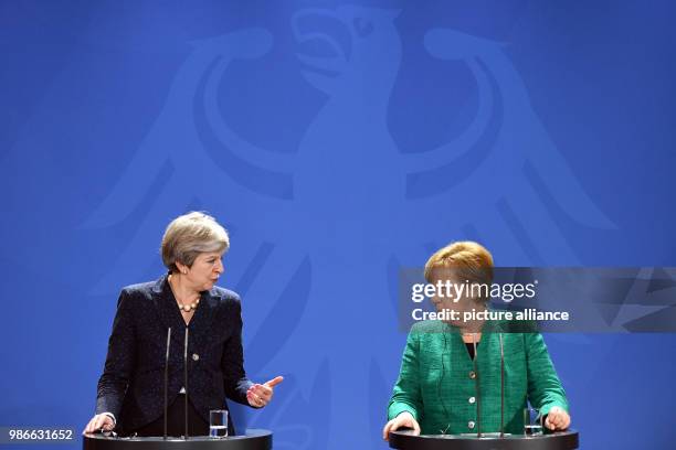 February 2018, Berlin, Germany: German chancellor Angela Merkel and Great Britains Prime Minister Theresa May partake in a joint press conference...