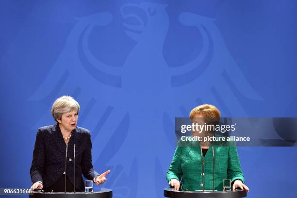 February 2018, Berlin, Germany: German chancellor Angela Merkel and Great Britains Prime Minister Theresa May partake in a joint press conference...