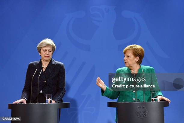 February 2018, Berlin, Germany: German chancellor Angela Merkel and Great Britains Prime Minister Theresa May partake in a joint press conference...