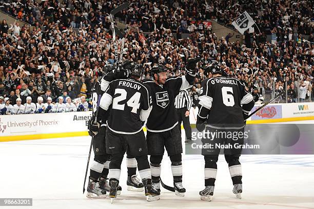 Alexander Frolov, Brad Richardson and Sean O'Donnell of the Los Angeles Kings celebrate after a goal against the Vancouver Canucks in Game Six of the...