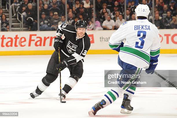 Fredrik Modin of the Los Angeles Kings skates with the puck against Kevin Bieksa of the Vancouver Canucks in Game Six of the Western Conference...