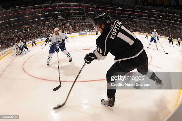 Anze Kopitar of the Los Angeles Kings skates with the puck against the Vancouver Canucks in Game Six of the Western Conference Quarterfinals during...
