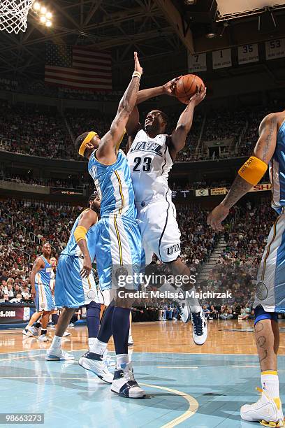 Wesley Matthews of the Utah Jazz goes up for the shot against J.R. Smith of the Denver Nuggets in Game Four of the Western Conference Quarterfinals...