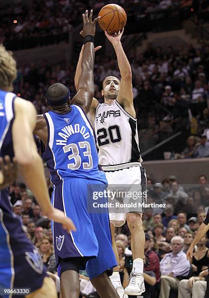 Guard Manu Ginobili of the San Antonio Spurs takes a shot against Brendan Haywood in Game Four of the Western Conference Quarterfinals during the...