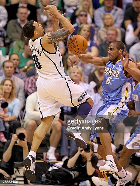 Deron Williams of the Utah Jazz loses contol of the ball while defended by Arron Afflalo of the Denver Nuggets during Game Four of the Western...