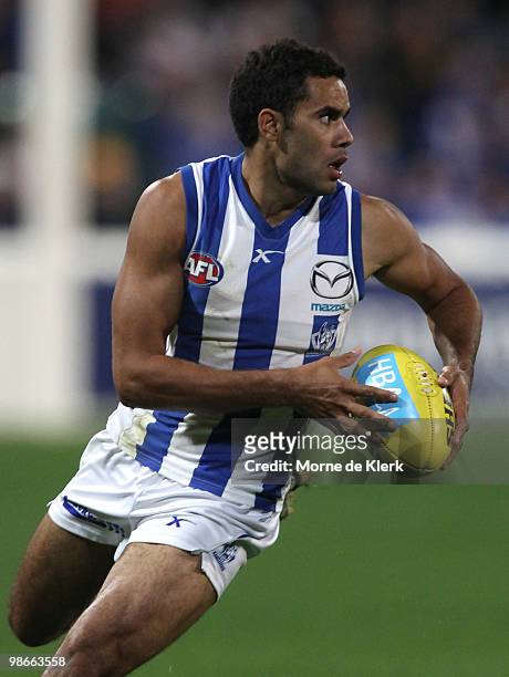 Daniel Wells of the Kangaroos runs with the ball during the round five AFL match between the Hawthorn Hawks and the North Melbourne Kangaroos at...