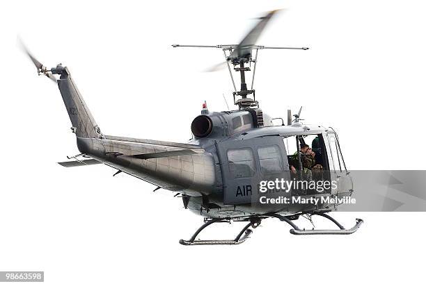 Air crash inspectors photograph the wreckage of the Air Force Iroqouis Helicopter that crashed in the hills surrounding Pukerua Bay on April 25, 2010...