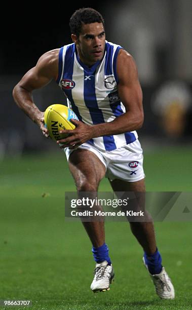 Daniel Wells of the Kangaroos runs with the ball during the round five AFL match between the Hawthorn Hawks and the North Melbourne Kangaroos at...