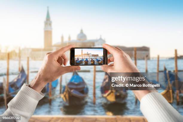 tourist taking a picture of personal perspective view. - marco bottigelli stock pictures, royalty-free photos & images