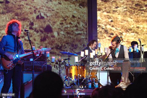 Dave Keuning, Ronnie Vannucci and Brandon Flowers of the Killers perform