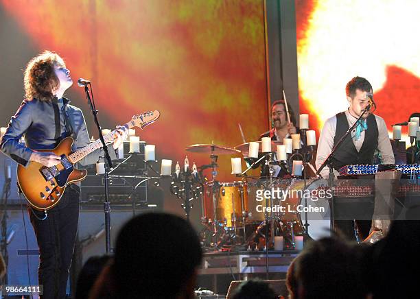 Dave Keuning, Ronnie Vannucci and Brandon Flowers of the Killers perform