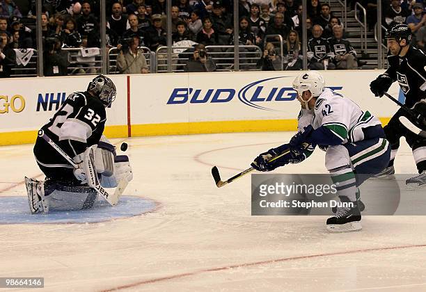 Jonathan Quick of the Los Angeles Kings stops a shot by Kyle Wellwood of the Vancouver Canucks during Game Six of the Western Conference...