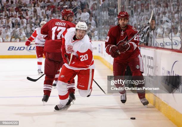 Drew Miller of the Detroit Red Wings skates after the puck in Game Five of the Western Conference Quarterfinals against the Phoenix Coyotes during...