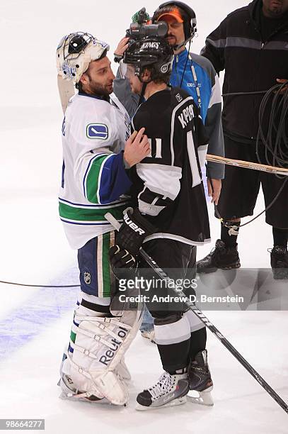 Roberto Luongo of the Vancouver Canucks shakes hands with Anze Kopitar of the Los Angeles Kings after Game Six of the Western Conference...