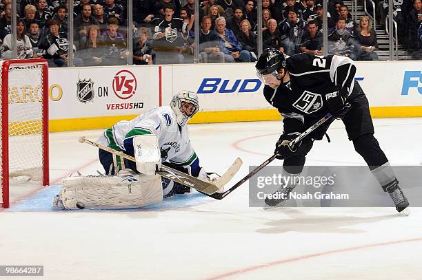 Alexander Frolov of the Los Angeles Kings tries to score against Roberto Luongo of the Vancouver Canucks in Game Six of the Western Conference...