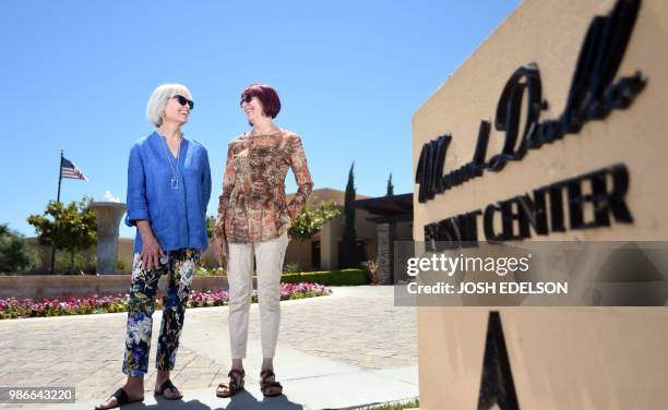 Kyle Johnson and MaryLou Molinaro, co-chairs of the Cannabis Discussion Club, pose for a photo at Trilogy at the Vineyards in Brentwood, some 55...