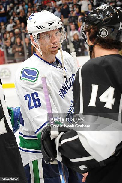 Mikael Samuelsson of the Vancouver Canucks shakes hands with Justin Williams of the Los Angeles Kings after Game Six of the Western Conference...