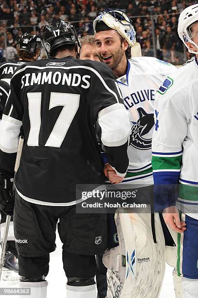 Wayne Simmonds of the Los Angeles Kings shakes hands with Roberto Luongo of the Vancouver Canucks after Game Six of the Western Conference...