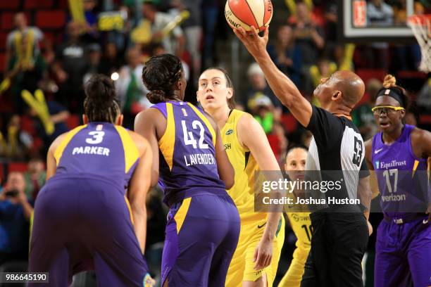 Breanna Stewart of the Seattle Storm and Jantel Lavender of the Los Angeles Sparks prepare for the jumpball on June 28, 2018 at Key Arena in Seattle,...