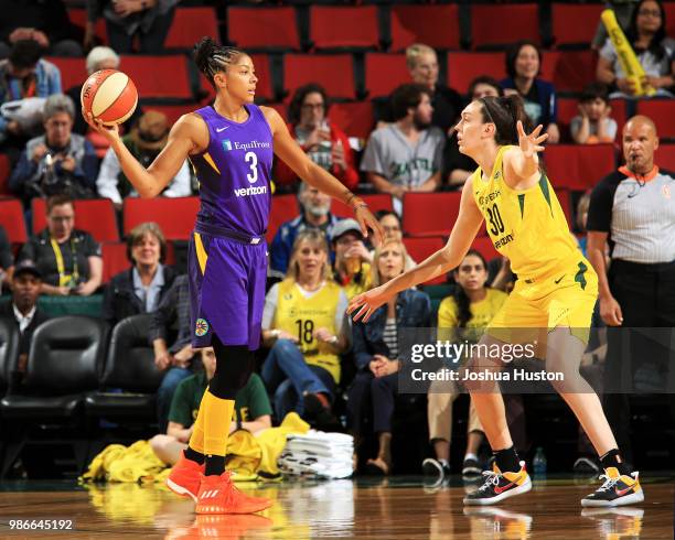 Candace Parker of the Los Angeles Sparks passes the ball against the Seattle Storm on June 28, 2018 at Key Arena in Seattle, Washington. NOTE TO...