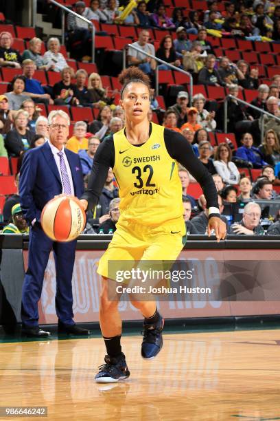 Alysha Clark of the Seattle Storm handles the ball against the Los Angeles Sparks on June 28, 2018 at Key Arena in Seattle, Washington. NOTE TO USER:...