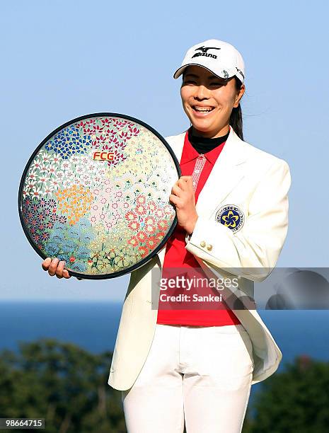Mayu Hattori poses with the trophy after winning the 29th Fuji Sankei Ladies Classic at Kawana Hotel Golf Course on April 25, 2010 in Kawana,...