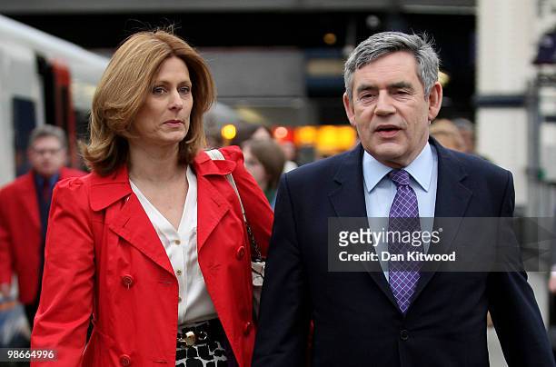 British Prime Minister Gordon Brown and wife Sarah Brown prepare to board a train at Waterloo Station ahead of a day along the South coast on the...