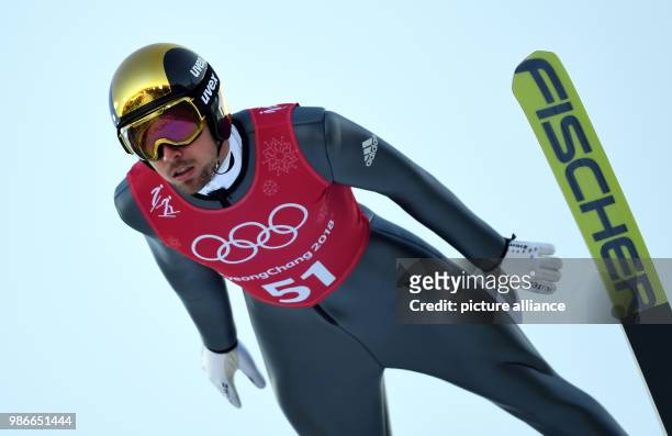 Johannes Rydzek from Germany flying off the large hill during training for the nordic combined event of the 2018 Winter Olympics in the Alpensia Ski...