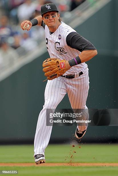 Shortstop Troy Tulowitzki of the Colorado Rockies plays defense, fields a ground ball and throws out Gaby Sanchez of the Florida Marlins at Coors...