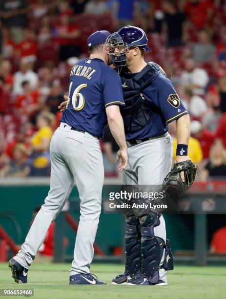 Corey Knebel and Erik Kratz of the Milwaukee Brewers share a hug after the last out of the 6-4 win against the Cincinnati Reds at Great American Ball...