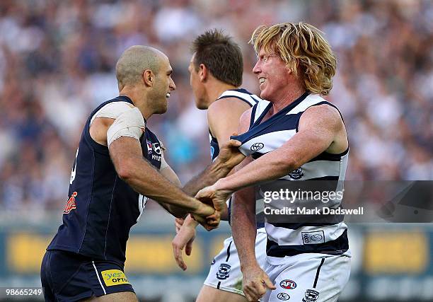 Chris Judd of the Blues and Cameron Ling of the Cats wrestle during the round five AFL match between the Carlton Blues and the Geelong Cats at...