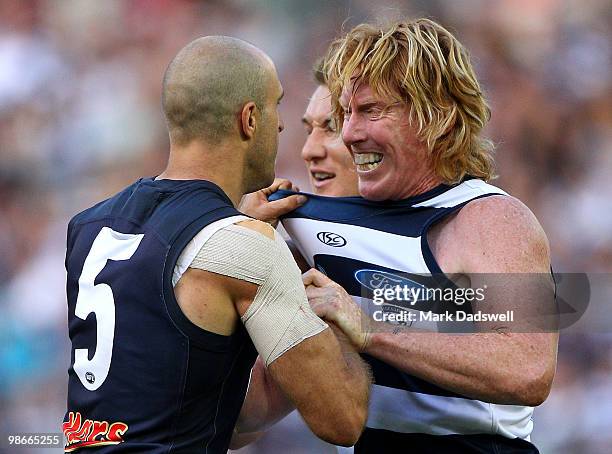 Chris Judd of the Blues and Cameron Ling of the Cats wrestle during the round five AFL match between the Carlton Blues and the Geelong Cats at...