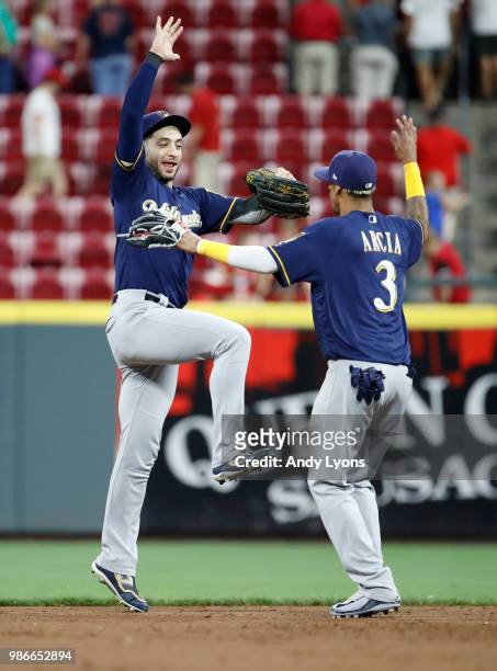 Ryan Braun and Orlando Arcia of the Milwaukee Brewers celebrate after the last out of the 6-4 win against the Cincinnati Reds at Great American Ball...