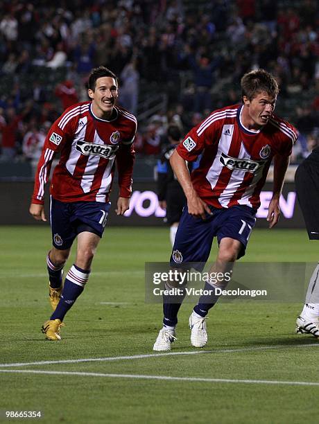 Justin Braun of Chivas USA celebrates after his second half goal against the San Jose Earthquakes followed by teammate Sacha Kljestan during their...