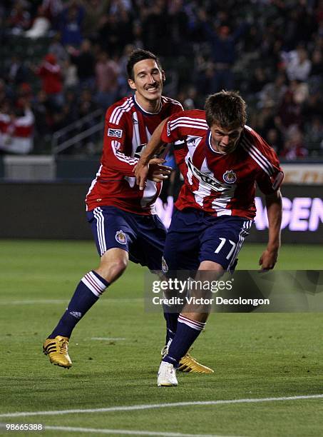 Justin Braun of Chivas USA celebrates after his second half goal against the San Jose Earthquakes as teammate Sacha Kljestan looks on during their...