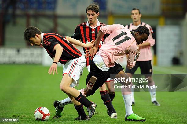 Jerry Mbakogu of Palermo and Luca Ghiringhelli of Milan compete for the ball during the Primavera Tim Cup between AC Milan and US Citta di Palermo at...
