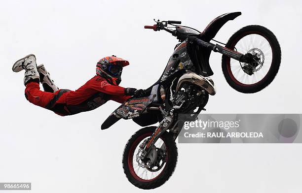 Colombian motorcyclits Duver Restrepo "El Pollo " performs during a freestyle motocross show at the Two Wheels Fair on April 24, 2010 in Medellin,...