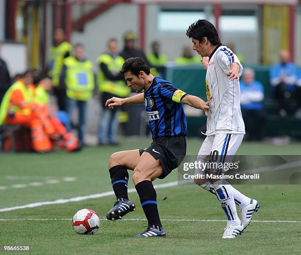 Javier Zanetti of FC Internazionale Milano battles for the ball against Zapata Jaime Valdes of Atalanta BC during the Serie A match between FC...