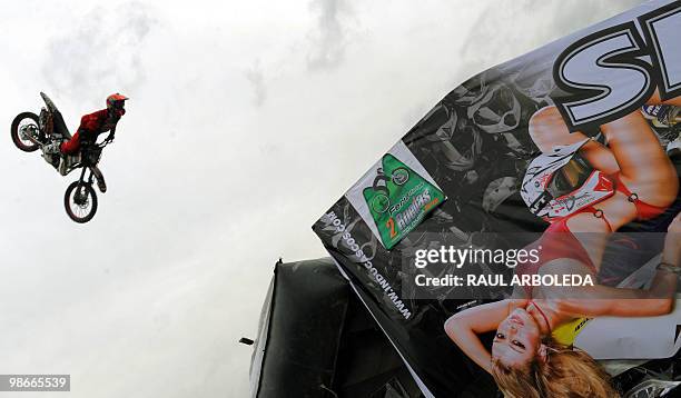 Colombian motorcyclits Duver Restrepo "El Pollo " performs during a freestyle motocross show at the Two Wheels Fair on April 24, 2010 in Medellin,...