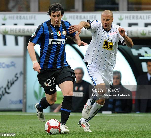 Diego Milito of FC Internazionale Milano battles for the ball against Paolo Bianco of Atalanta BC during the Serie A match between FC Internazionale...