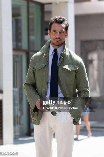 Model David Gandy wears a Thom Sweeney shirt, Emma Willis tie, Private White V.C jacket and trousers and Aerodrome by David Gandy for Aspinal of...