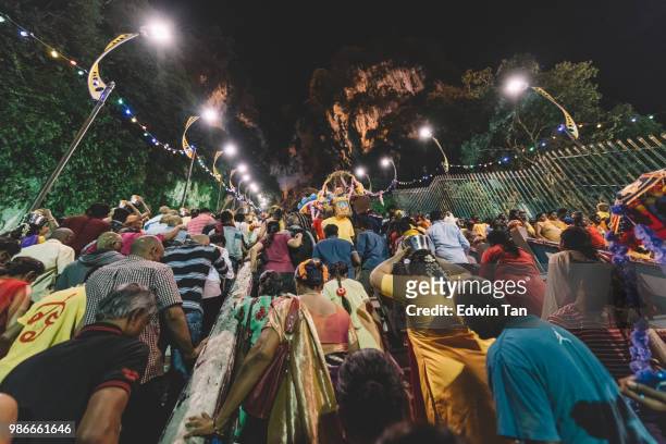 thousand of hindu prayers heading toward batu cave temple during the night of thaipusam in malaysia - batu caves stock pictures, royalty-free photos & images