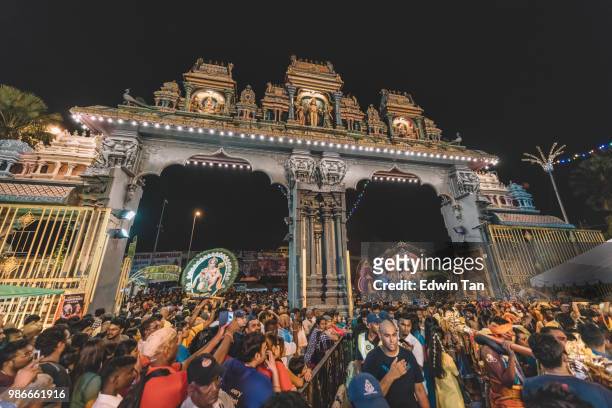 thousand of indian hindu prayer came thru the gate and begin to climb up to batu cave temple for praying at the night of thaipusam - traditional piercings stock pictures, royalty-free photos & images